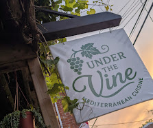 Our sign, lit up as the sun goes down